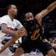 Cavs guard James Harden (1) dribbles defended