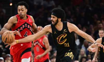 Toronto Raptors forward Scottie Barnes (4) goes for a loose ball against Cleveland Cavaliers center Jarrett Allen (31) during the second half of game seven in the first round of the 2026 NBA Playoffs at Rocket Arena.