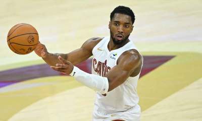 Cleveland Cavaliers guard Donovan Mitchell (45) throws a no-look pass against the Toronto Raptors in the third quarter of game five of the first round of the 2026 NBA Playoffs at Rocket Arena.