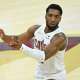 Cleveland Cavaliers guard Donovan Mitchell (45) throws a no-look pass against the Toronto Raptors in the third quarter of game five of the first round of the 2026 NBA Playoffs at Rocket Arena.