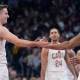 Cleveland Cavaliers guard Sam Merrill (5) and guard Donovan Mitchell (45) celebrate a basket against the Toronto Raptors at Scotiabank Arena.