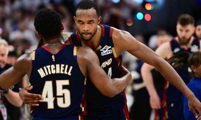 Cleveland Cavaliers guard Donovan Mitchell (45) hugs center Evan Mobley (4) after game three against the Detroit Pistons in the second round of the 2026 NBA Playoffs at Rocket Arena.