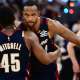 Cleveland Cavaliers guard Donovan Mitchell (45) hugs center Evan Mobley (4) after game three against the Detroit Pistons in the second round of the 2026 NBA Playoffs at Rocket Arena.