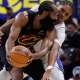 Cleveland Cavaliers guard James Harden (1) is defended by Detroit Pistons guard Ausar Thompson (9) in the second half during game one of the second round of the 2026 NBA Playoffs at Little Caesars Arena.