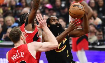 May 3, 2026; Cleveland, Ohio, USA; Cleveland Cavaliers guard James Harden (1) drives to the basket against Toronto Raptors guard Jamal Shead (23) and center Jakob Poeltl (19) during the first quarter of game seven in the first round of the 2026 NBA Playoffs at Rocket Arena. Mandatory Credit: Ken Blaze-Imagn Images