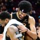 Cleveland Cavaliers guard Donovan Mitchell (45) hugs Cleveland Cavaliers center Jarrett Allen (31) after game seven against the Toronto Raptors In the first round of the 2026 NBA Playoffs at Rocket Arena.