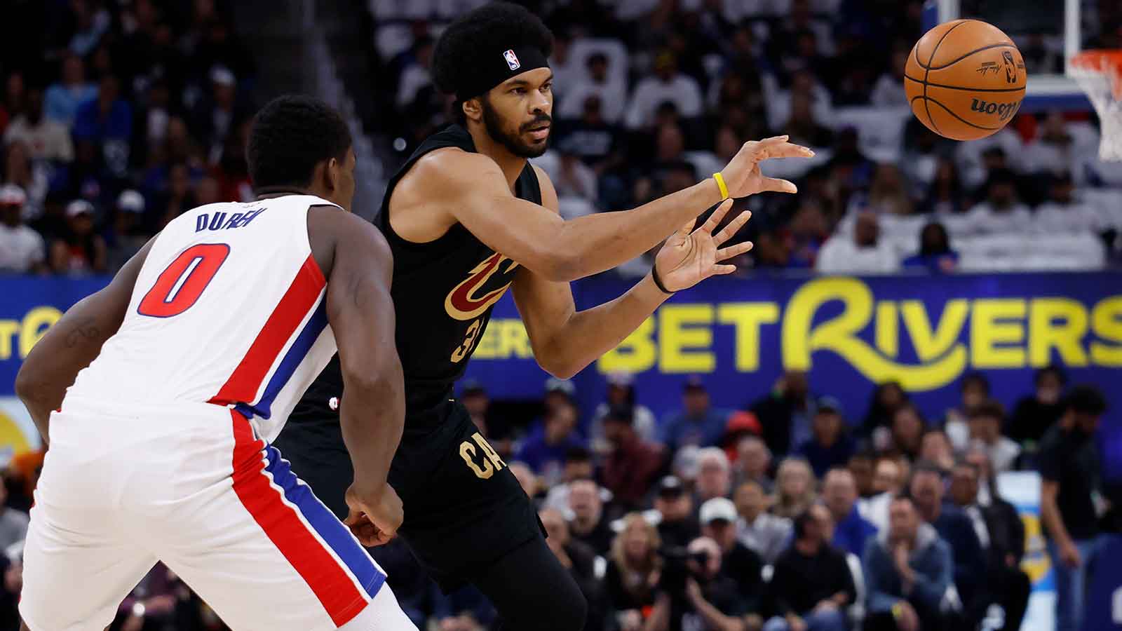 Cleveland Cavaliers center Jarrett Allen (31) passes defended by Detroit Pistons center Jalen Duren (0) in the first half during game one of the second round of the 2026 NBA Playoffs at Little Caesars Arena.
