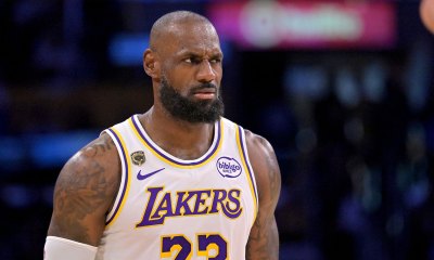 Lakers forward LeBron James (23) reacts after a foul in game three of the second round of the 2026 NBA Playoffs against the Oklahoma City Thunder at Crypto.com Arena with the Cavs logo in the background
