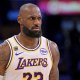 Lakers forward LeBron James (23) reacts after a foul in game three of the second round of the 2026 NBA Playoffs against the Oklahoma City Thunder at Crypto.com Arena with the Cavs logo in the background