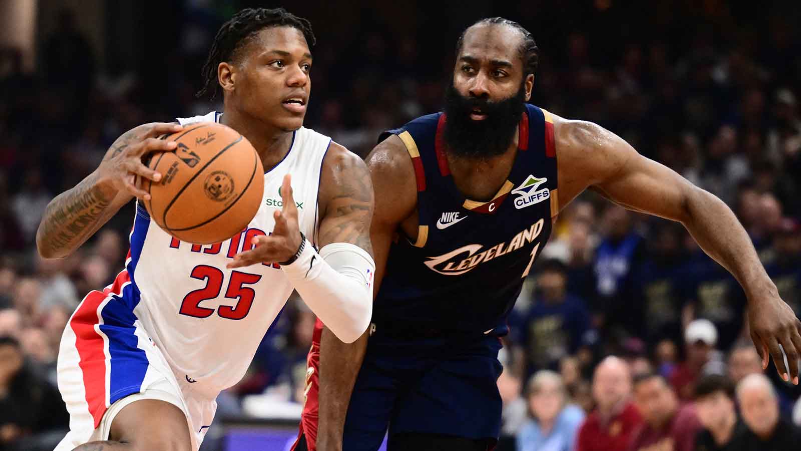 Pistons guard Marcus Sasser (25) drives vs. Cavs' James Harden