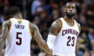 Cavs forward LeBron James (23) reacts during the fourth quarter with guard J.R. Smith (5) against the Golden State Warriors in game six of the NBA Finals at Quicken Loans Arena