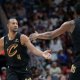 Cavs center Evan Mobley (4) celebrates with center Thomas Bryant (3) during the first half at Smoothie King Center with Jarrett Allen in the background