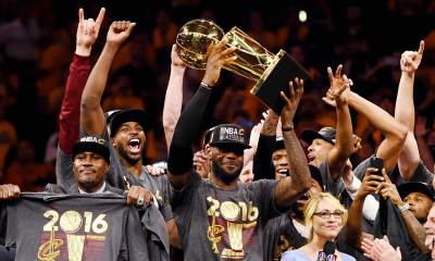 Cleveland Cavaliers forward LeBron James (23) and the Cleveland Cavaliers celebrates with the Larry O'Brien Championship Trophy after beating the Golden State Warriors in game seven of the NBA Finals at Oracle Arena.