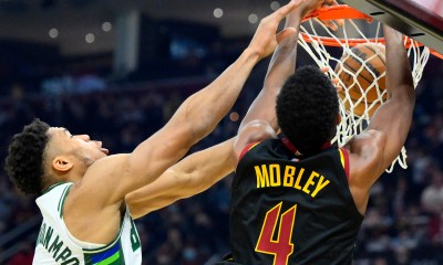 Cleveland Cavaliers center Evan Mobley (4) dunks beside Milwaukee Bucks forward Giannis Antetokounmpo (34) in the second quarter at Rocket Mortgage FieldHouse.
