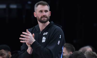 Utah Jazz forward Kevin Love (42) watches play against the Portland Trail Blazers during the first half at Delta Center.