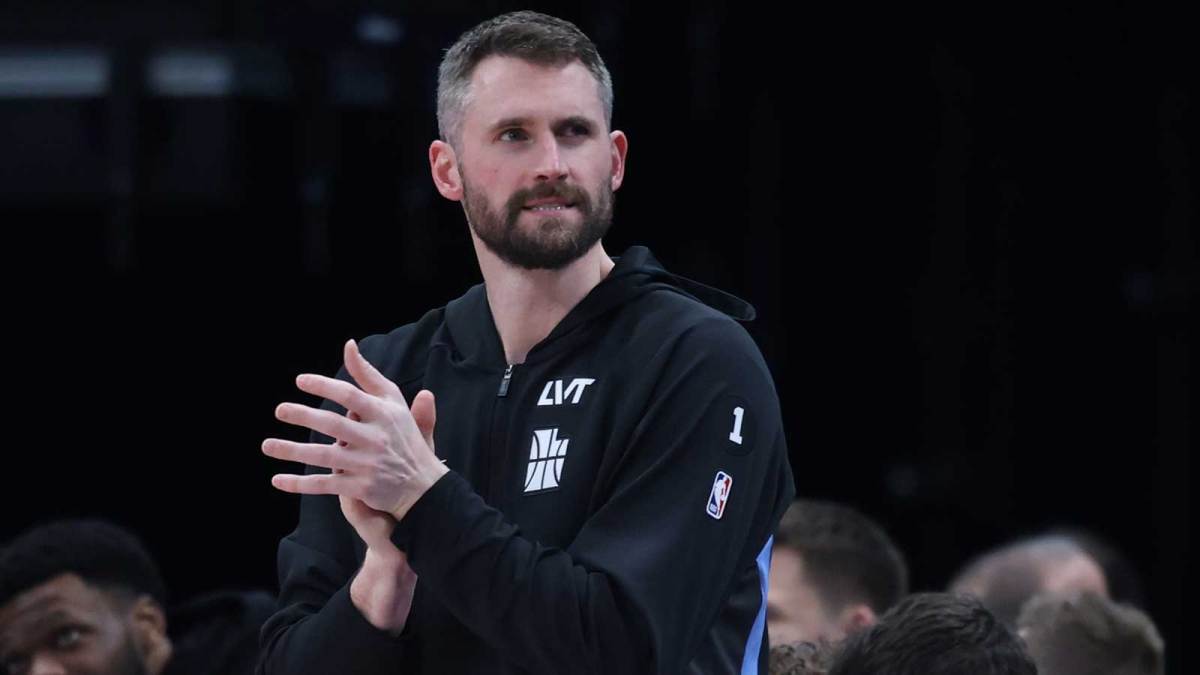 Utah Jazz forward Kevin Love (42) watches play against the Portland Trail Blazers during the first half at Delta Center.