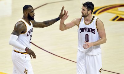Cleveland Cavaliers forward LeBron James (23) and forward Kevin Love (0) celebrate in the third quarter against the Memphis Grizzlies at Quicken Loans Arena.