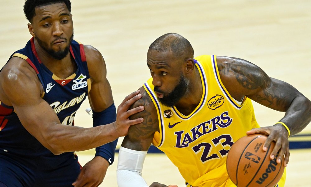 Cavaliers guard Donovan Mitchell (45) defends Los Angeles Lakers forward LeBron James (23) in the fourth quarter at Rocket Arena