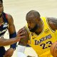 Cavaliers guard Donovan Mitchell (45) defends Los Angeles Lakers forward LeBron James (23) in the fourth quarter at Rocket Arena