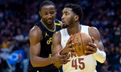 Warriors forward Jonathan Kuminga (00) defends against Cleveland Cavaliers guard Donovan Mitchell (45) during the third quarter at Chase Center