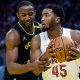 Warriors forward Jonathan Kuminga (00) defends against Cleveland Cavaliers guard Donovan Mitchell (45) during the third quarter at Chase Center