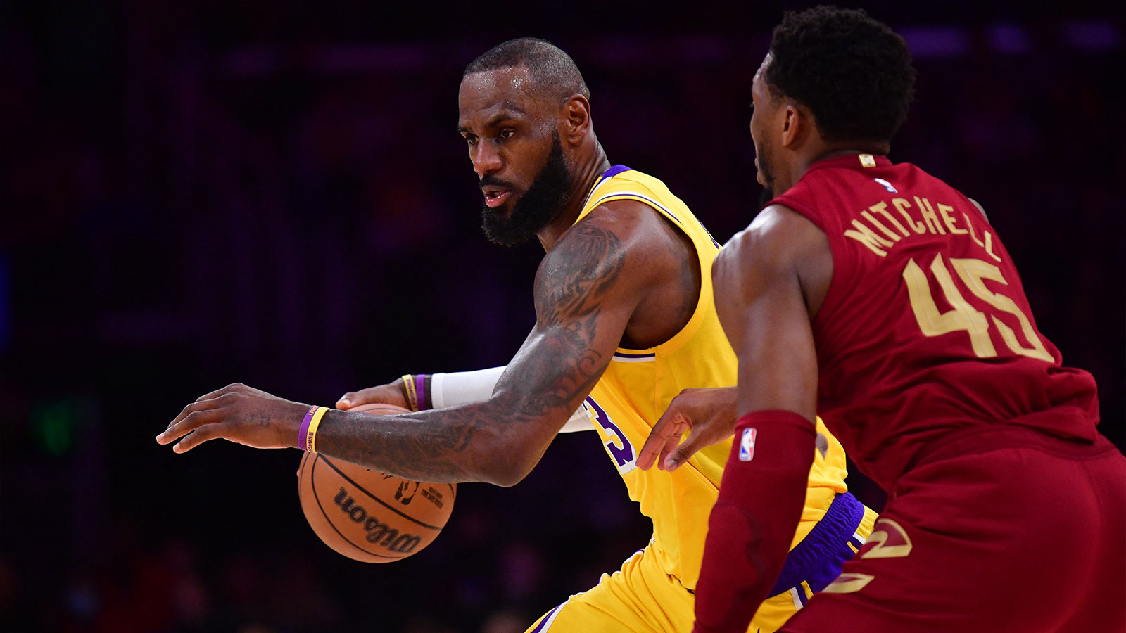 Lakers forward LeBron James (23) moves the ball against Cleveland Cavaliers guard Donovan Mitchell (45) during the first half at Crypto.com Arena