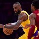 Lakers forward LeBron James (23) moves the ball against Cleveland Cavaliers guard Donovan Mitchell (45) during the first half at Crypto.com Arena