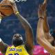 Los Angeles Lakers forward LeBron James (23) shoots beside Cleveland Cavaliers center Jarrett Allen (31) in the first quarter at Rocket Arena.