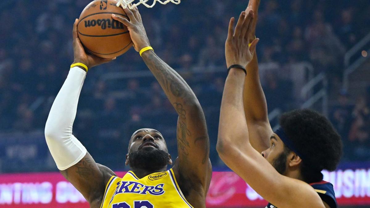 Los Angeles Lakers forward LeBron James (23) shoots beside Cleveland Cavaliers center Jarrett Allen (31) in the first quarter at Rocket Arena.