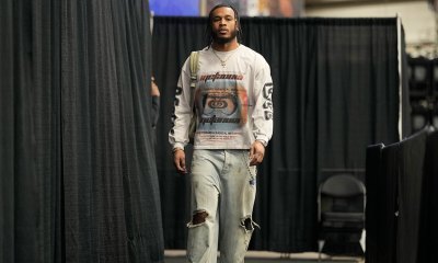 Cavs' Cam Whitmore (1) enters Frost Bank Center before a game against the San Antonio Spurs with Cavs' Peyton Watson in the background