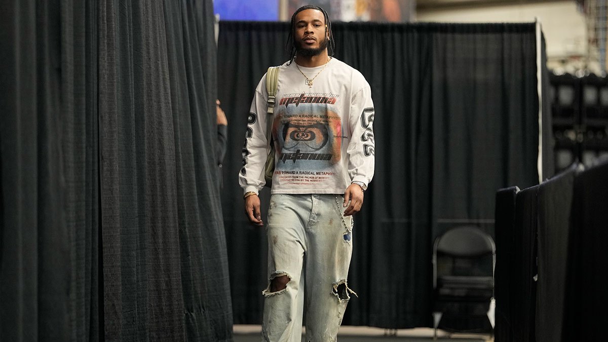 Cavs' Cam Whitmore (1) enters Frost Bank Center before a game against the San Antonio Spurs with Cavs' Peyton Watson in the background