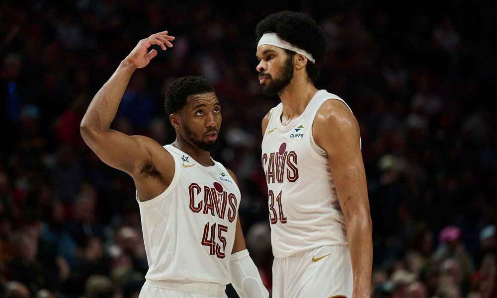 Cleveland Cavaliers guard Donovan Mitchell (45) talks to center Jarrett Allen (31) during the second half against the Portland Trail Blazers at Moda Center.