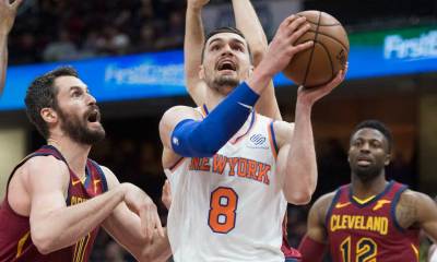 New York Knicks forward Mario Hezonja (8) drives to the basket against Cleveland Cavaliers forward Kevin Love (0) during the first half at Quicken Loans Arena.