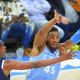 Cleveland Cavaliers guard Donovan Mitchell (45) throws a pass beside Denver Nuggets forward Peyton Watson (8) in the third quarter at Rocket Mortgage FieldHouse.