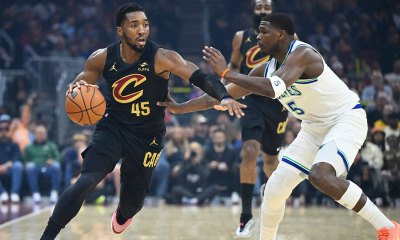 Cleveland Cavaliers guard Donovan Mitchell (45) dribbles beside Minnesota Timberwolves guard Anthony Edwards (5) in the first quarter at Rocket Arena.