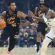 Cleveland Cavaliers guard Donovan Mitchell (45) dribbles beside Minnesota Timberwolves guard Anthony Edwards (5) in the first quarter at Rocket Arena.