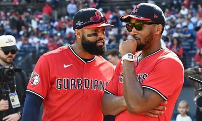 Cleveland Guardians outfielder Jo Adell (7) speaks with Cleveland Cavaliers guard Donovan Mitchell prior to a ceremonial first pitch before game three of the ALCS between Tampa Bay Rays and Cleveland Guardians in the 2026 MLB Playoffs at Progressive Field. Mandatory Credit: Ken Blaze-Imagn Images
