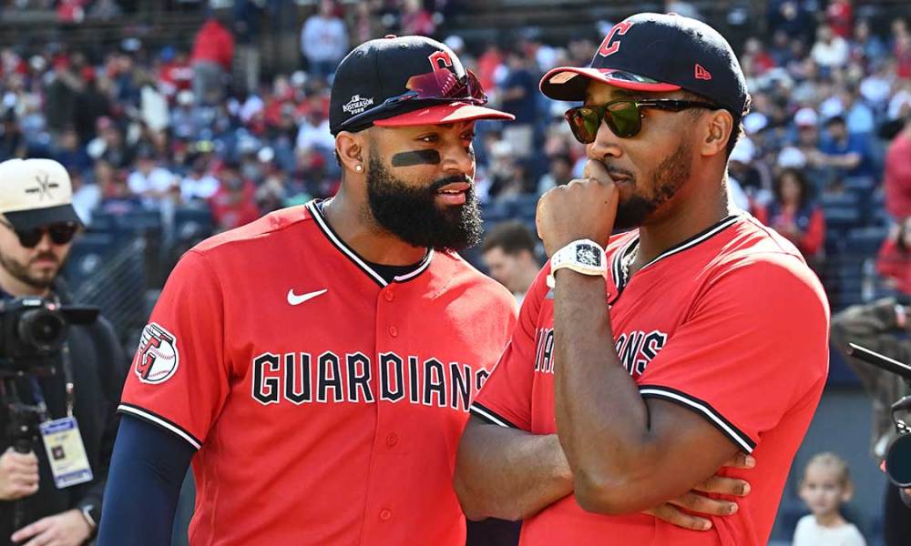 Cleveland Guardians outfielder Jo Adell (7) speaks with Cleveland Cavaliers guard Donovan Mitchell prior to a ceremonial first pitch before game three of the ALCS between Tampa Bay Rays and Cleveland Guardians in the 2026 MLB Playoffs at Progressive Field. Mandatory Credit: Ken Blaze-Imagn Images