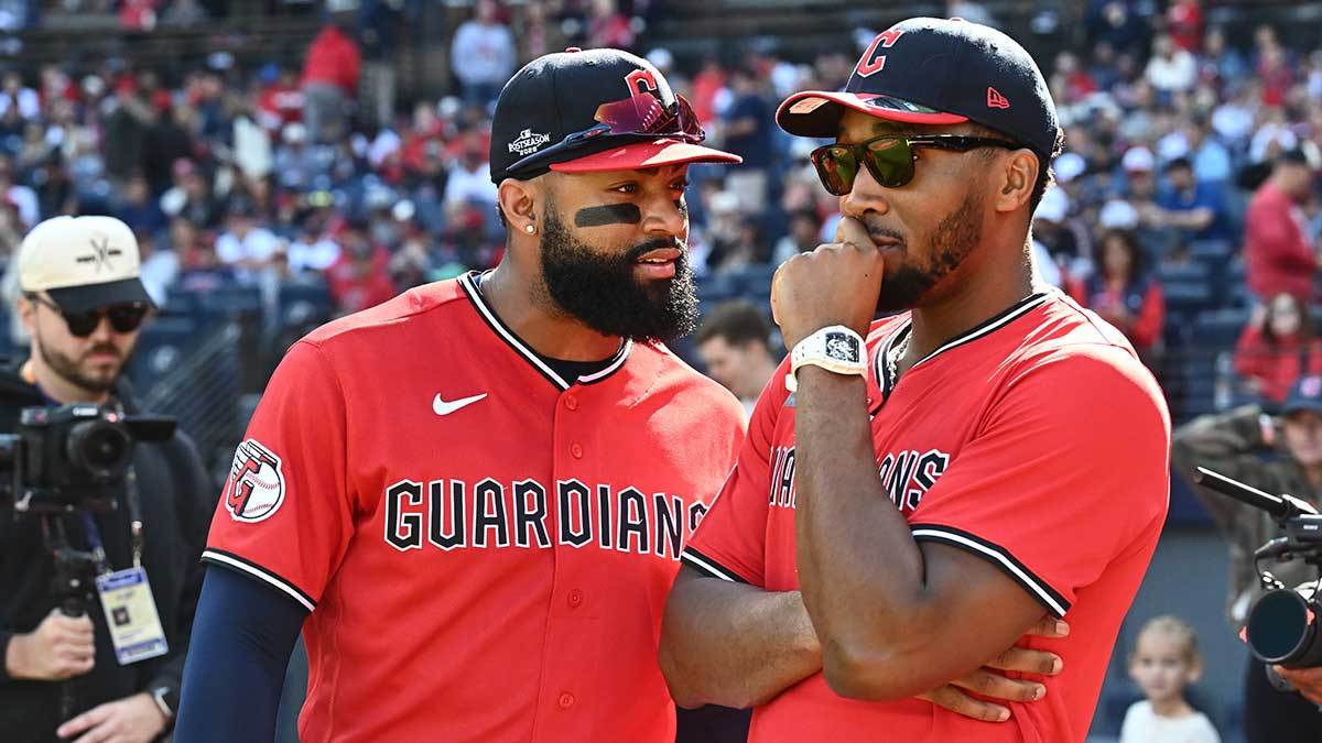 Cleveland Guardians outfielder Jo Adell (7) speaks with Cleveland Cavaliers guard Donovan Mitchell prior to a ceremonial first pitch before game three of the ALCS between Tampa Bay Rays and Cleveland Guardians in the 2026 MLB Playoffs at Progressive Field. Mandatory Credit: Ken Blaze-Imagn Images