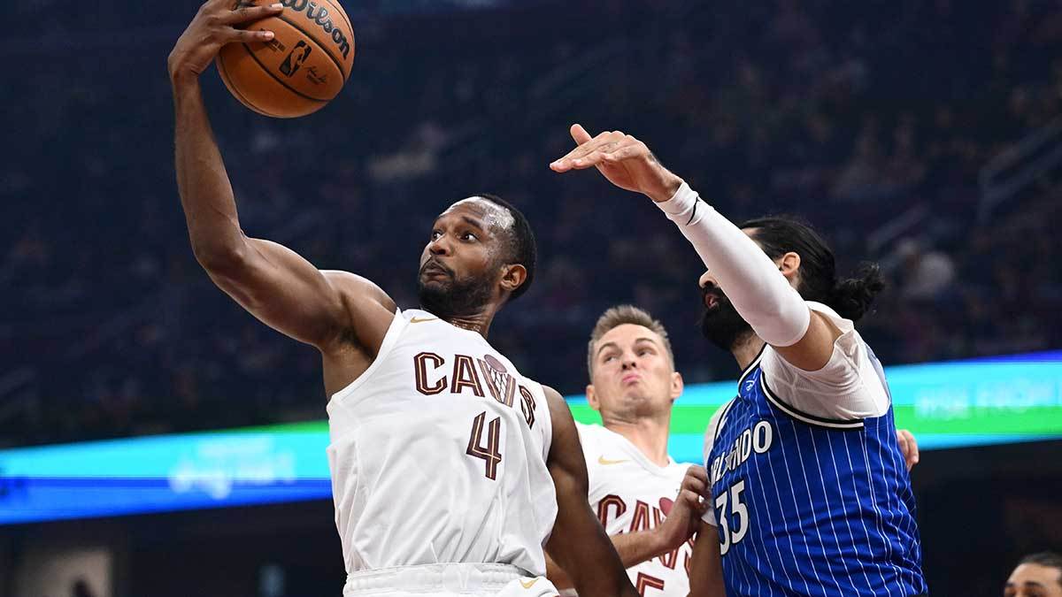 Cleveland Cavaliers center Evan Mobley (4) goes for a rebound against Orlando Magic center Goga Bitadze (35) during the first half at Rocket Arena.