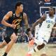 Cleveland Cavaliers guard Meleek Thomas (15) dribbles beside Minnesota Timberwolves guard Anthony Edwards (5) in the first quarter at Rocket Arena.